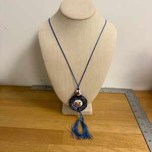 Painted horse porcelain pendant necklace on a blue string with tassel